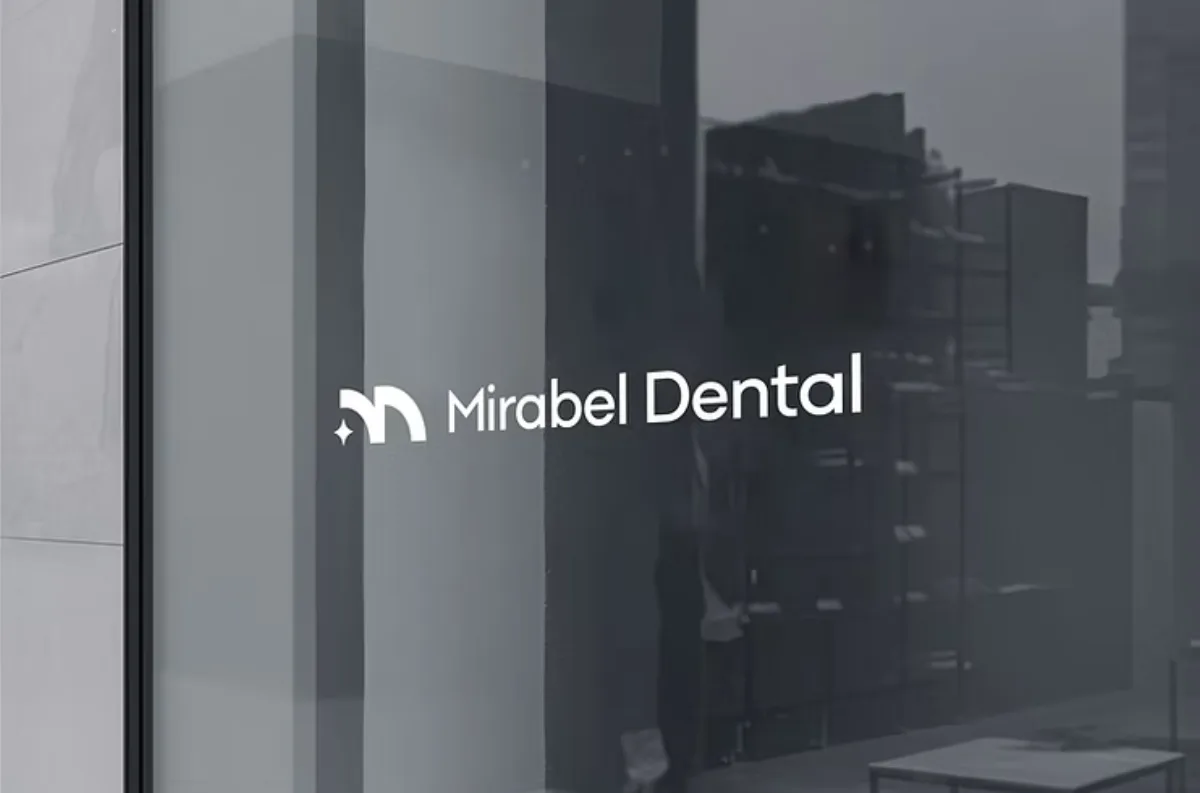 The Mirabel Dental logo etched on the clinic's glass frontage.